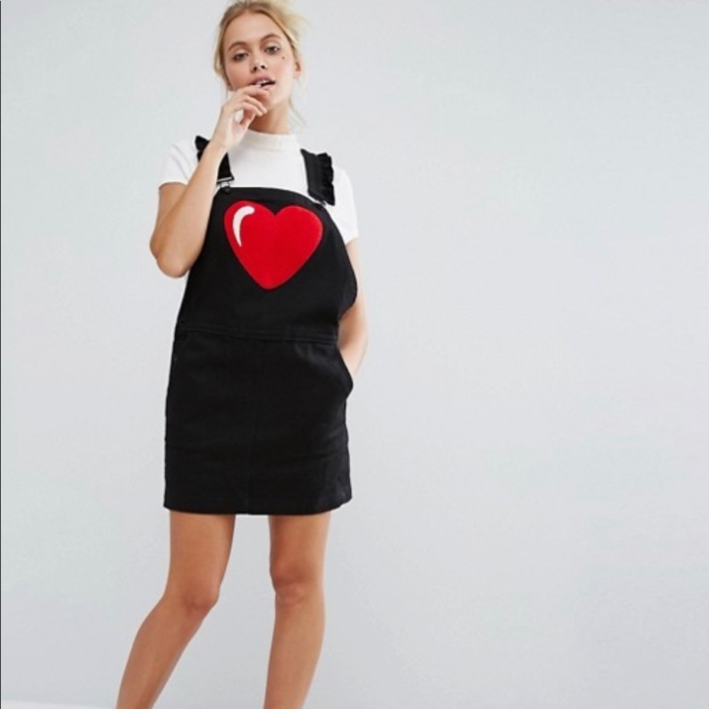 Black overall dress with heart.